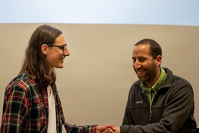 Student Oscar Gal, recipient of the Math Excellence award, shakes hands with Professor Gil Rosenberg during the academic award ceremony, Spring 2022.