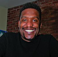 Picture of Marc Thurman, a Black male with short mustache and goatee